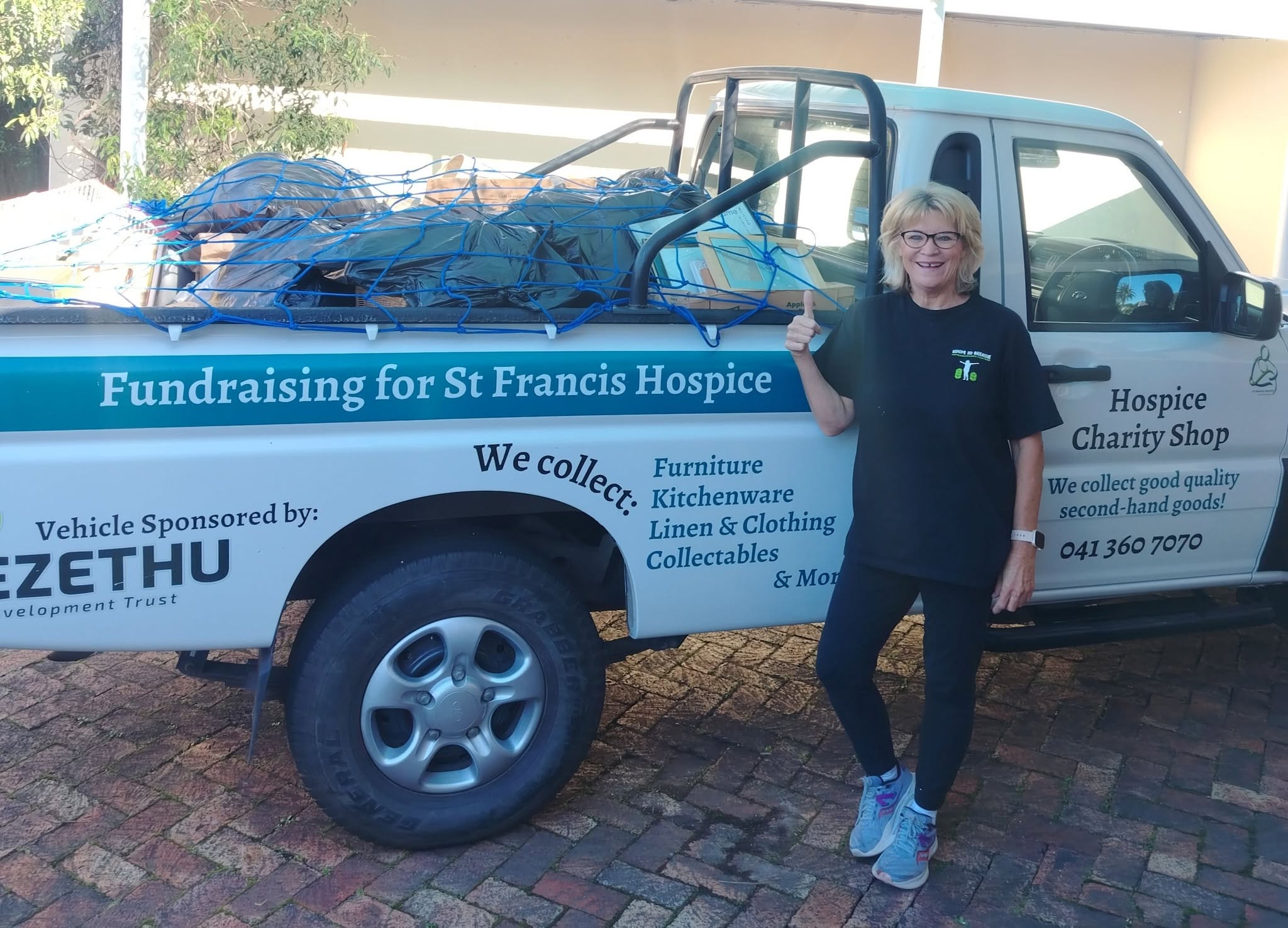 Robyn after a recent move, with donations bound for the St Francis Hospice charity shop