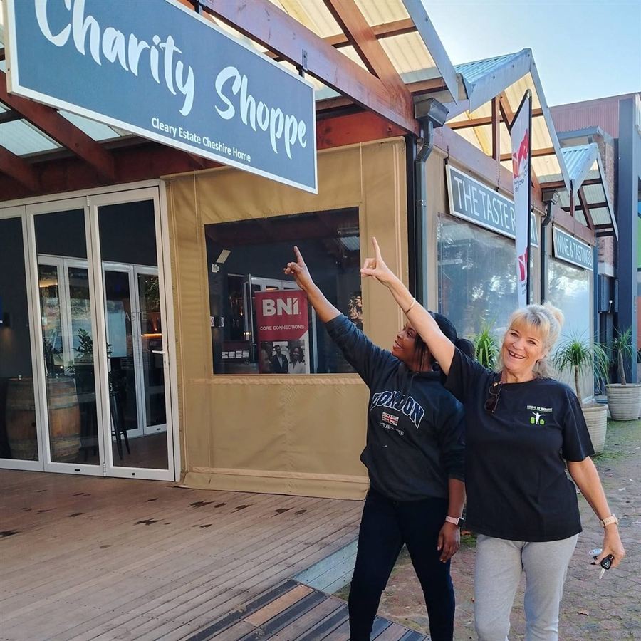 Robyn and a colleague outside a local charity shop