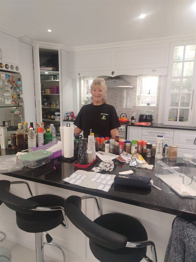 A client's kitchen laid out and sorted, deciding what comes along
